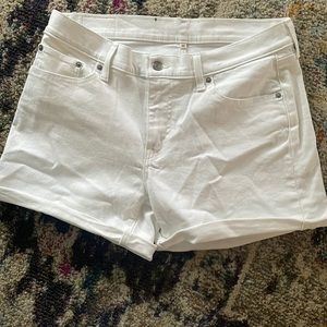 White Levi’s shorts. Size 32 waist.